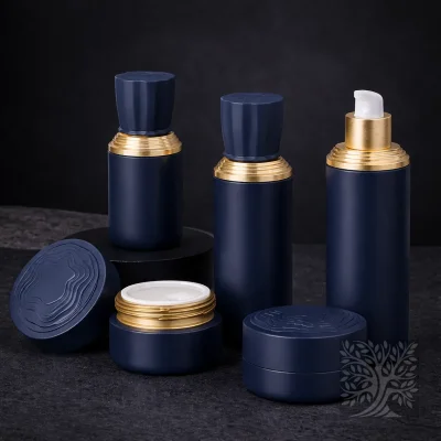 Matte navy skincare bottles and cosmetic jars with gold accents, grouped with open jar and lid in foreground.