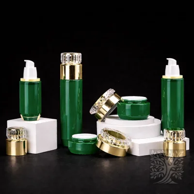 Deep green glass bottles and cosmetic jars with gold accents, displayed on white platforms in a clean layout.