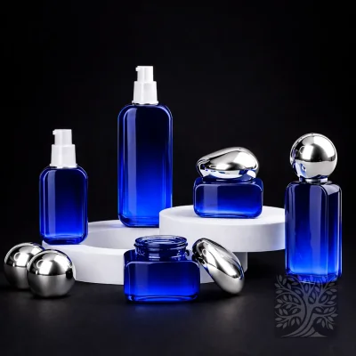 Cobalt blue glass bottles and cosmetic jars with silver caps, displayed in a refined Macigno packaging composition.