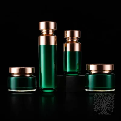GrEmerald green acrylic skincare bottles and cream jars with gold caps, displayed as a premium Halo packaging collection.een and Gold