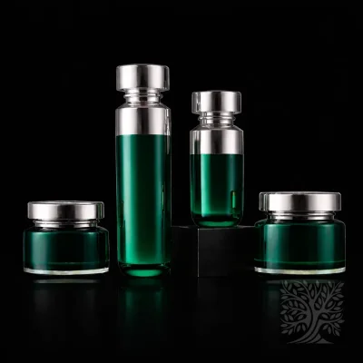 Teal green acrylic bottles and cosmetic jars with polished silver closures, presented as a cohesive Halo skincare packaging design.
