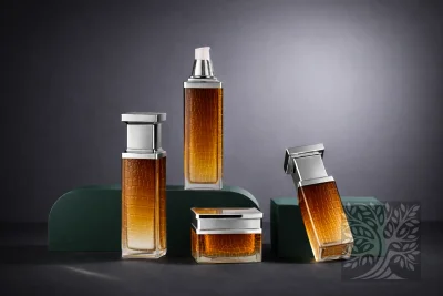 Amber textured acrylic skincare bottles and cosmetic jars with silver caps, arranged on platforms with angled container.